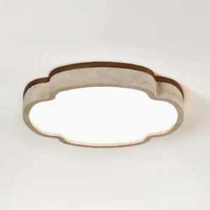 Lunet LED flush mount ceiling lamp three-quarter angle showing speckled travertine stone frame detail