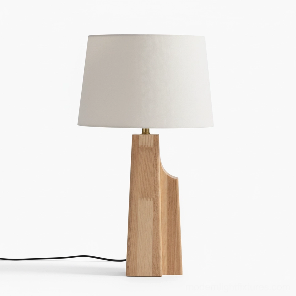 Lunet table lamp front studio view with asymmetrical wooden base and soft off-white lampshade