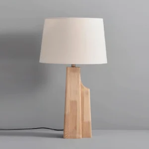 Lunet table lamp three-quarter angle showing natural wood grain and stepped asymmetrical base