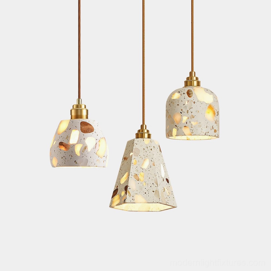 Lunette terrazzo pendant light collection - modern mid-century style with brass fixtures and natural stone shades