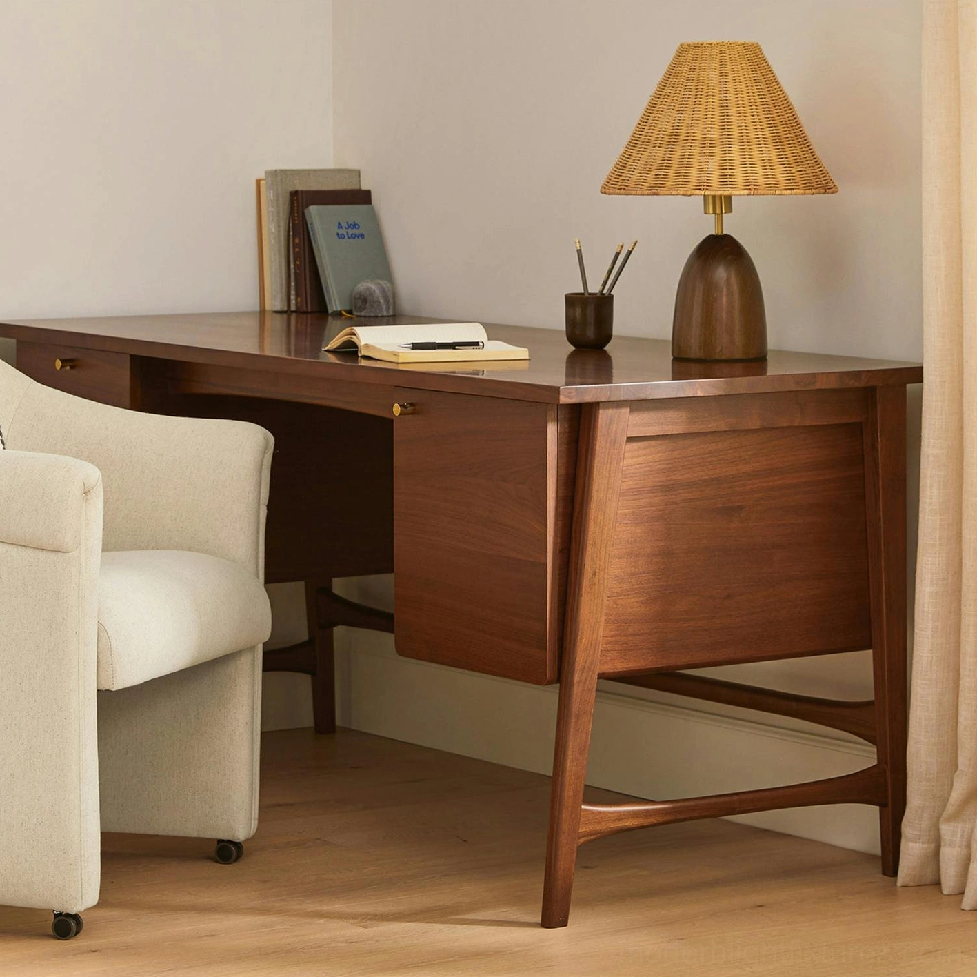 Lunora table lamp in home office setting with mid-century modern desk and upholstered chair