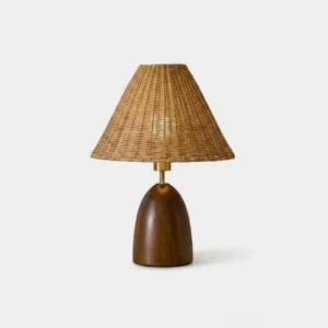 Lunora rattan table lamp with tapered woven shade and sculptural pine base, studio product shot