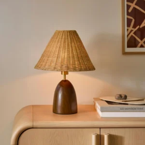 Lunora coastal table lamp styled on bedroom nightstand with natural wood cabinet and minimalist wall art