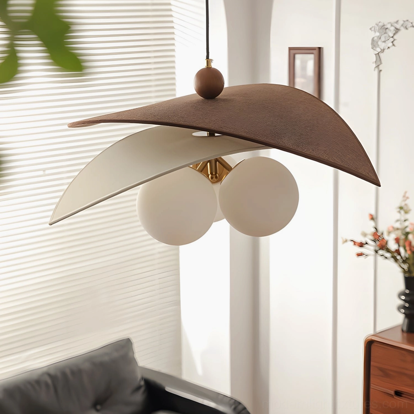 Trio of frosted milky glass globes in Lunova pendant lamp, showing light diffusion and warm ambient glow