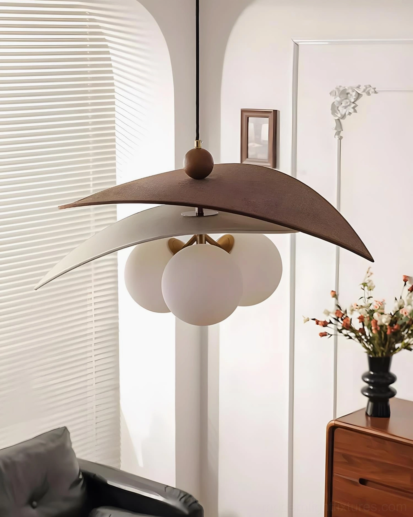 Lunova modern pendant fixture above transitional dining space blending mid-century style with contemporary aesthetics