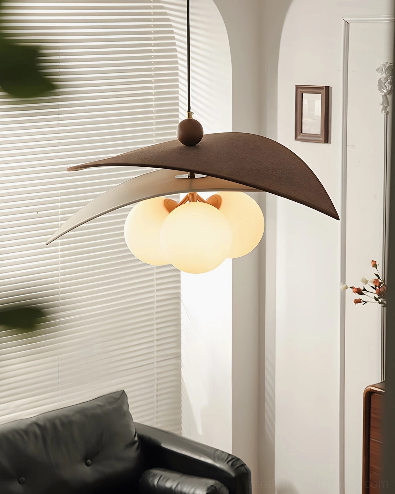 Lunova modern pendant light fixture with walnut wood frame and raffia texture, detailed close-up of sculptural design elements
