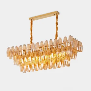 Lunvara linear crystal chandelier overhead view showing hand-hung amber faceted glass prisms with polished brass frame