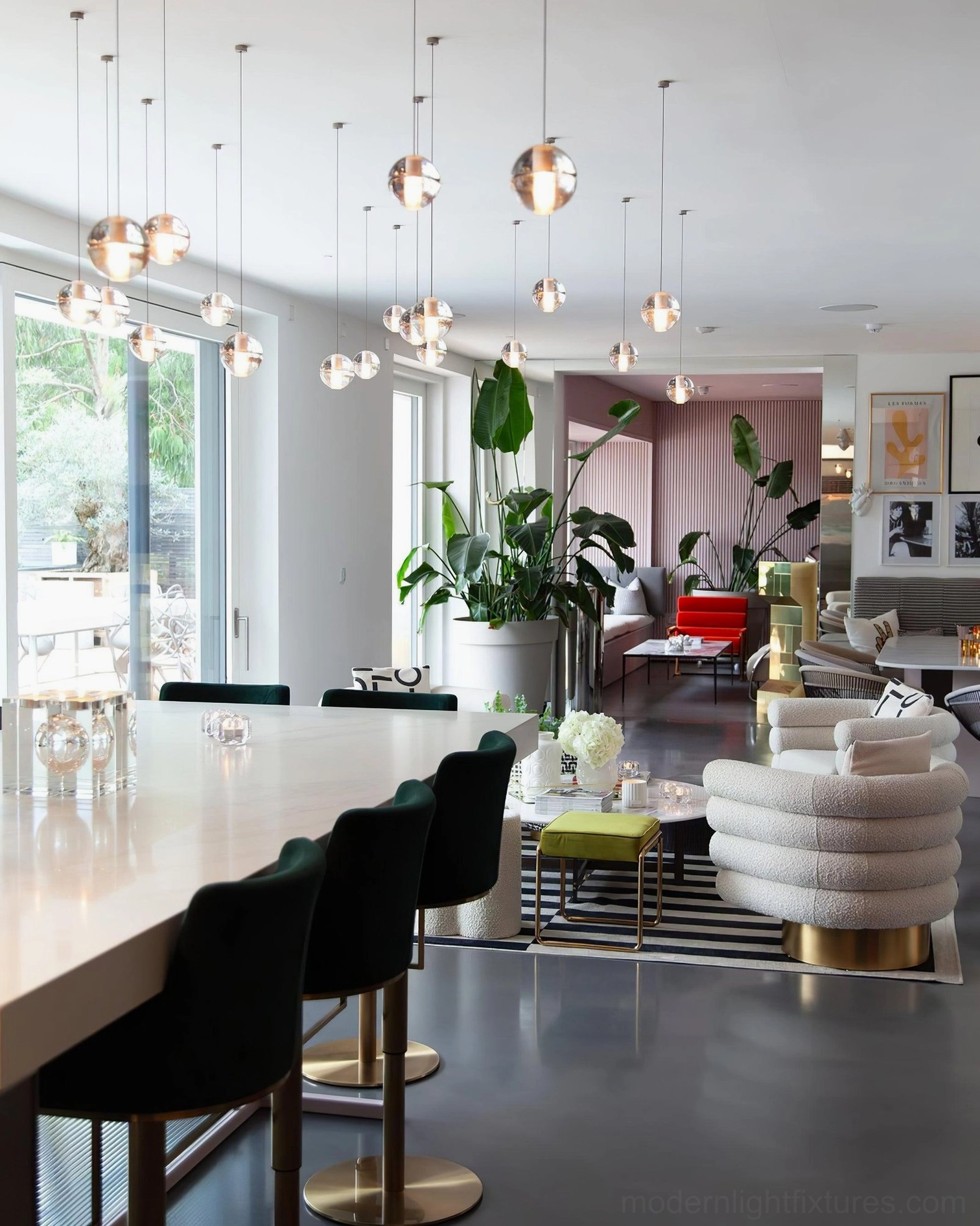 Large-scale crystal chandelier installed in modern luxury dining room with mixed-size glass pendants
