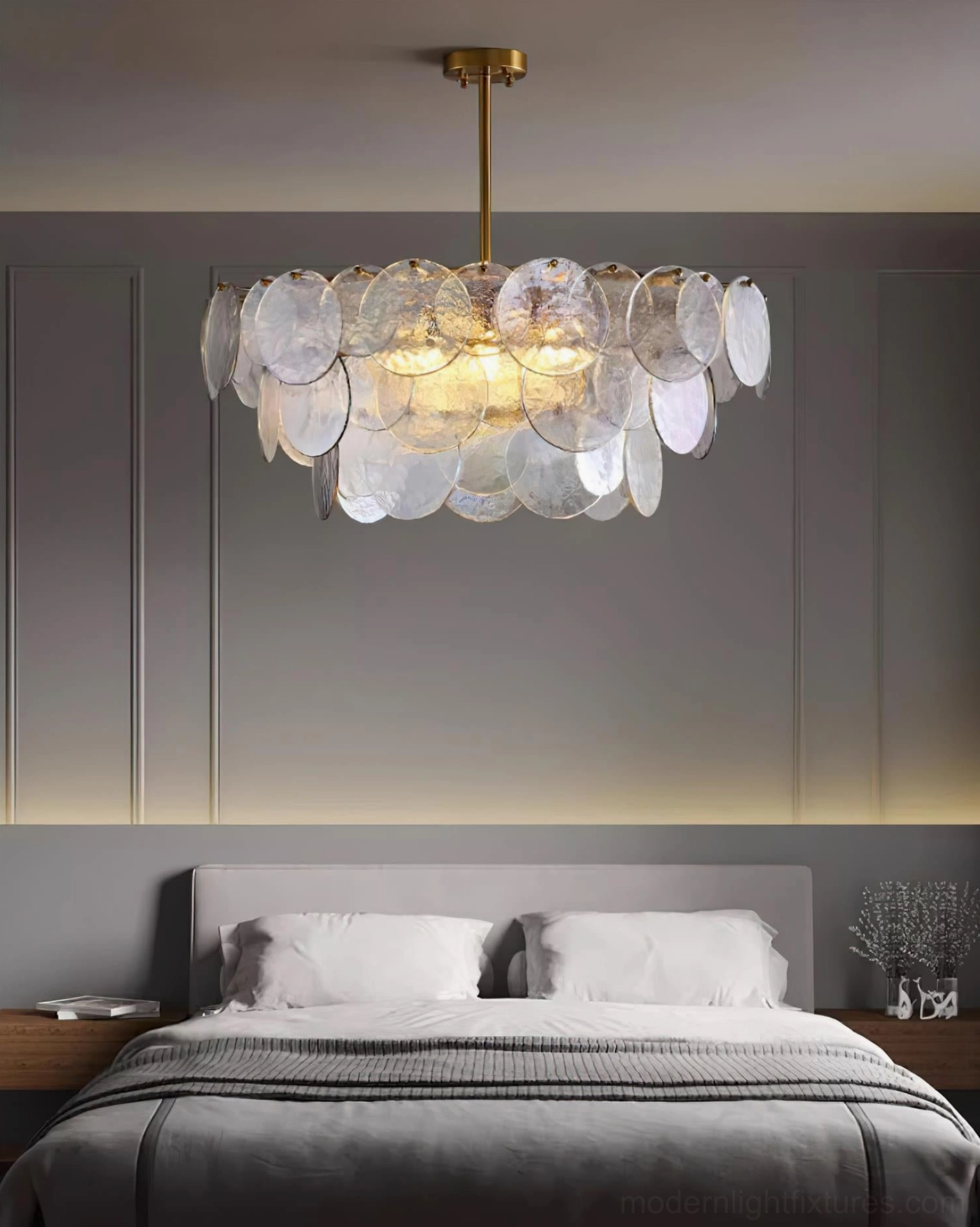 Luxury disc pendant chandelier with iridescent glass showing contemporary minimalist aesthetic