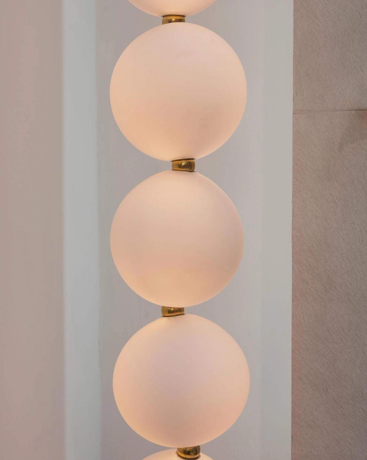 Luxury pearl necklace chandelier creating architectural focal point with sculptural illumination