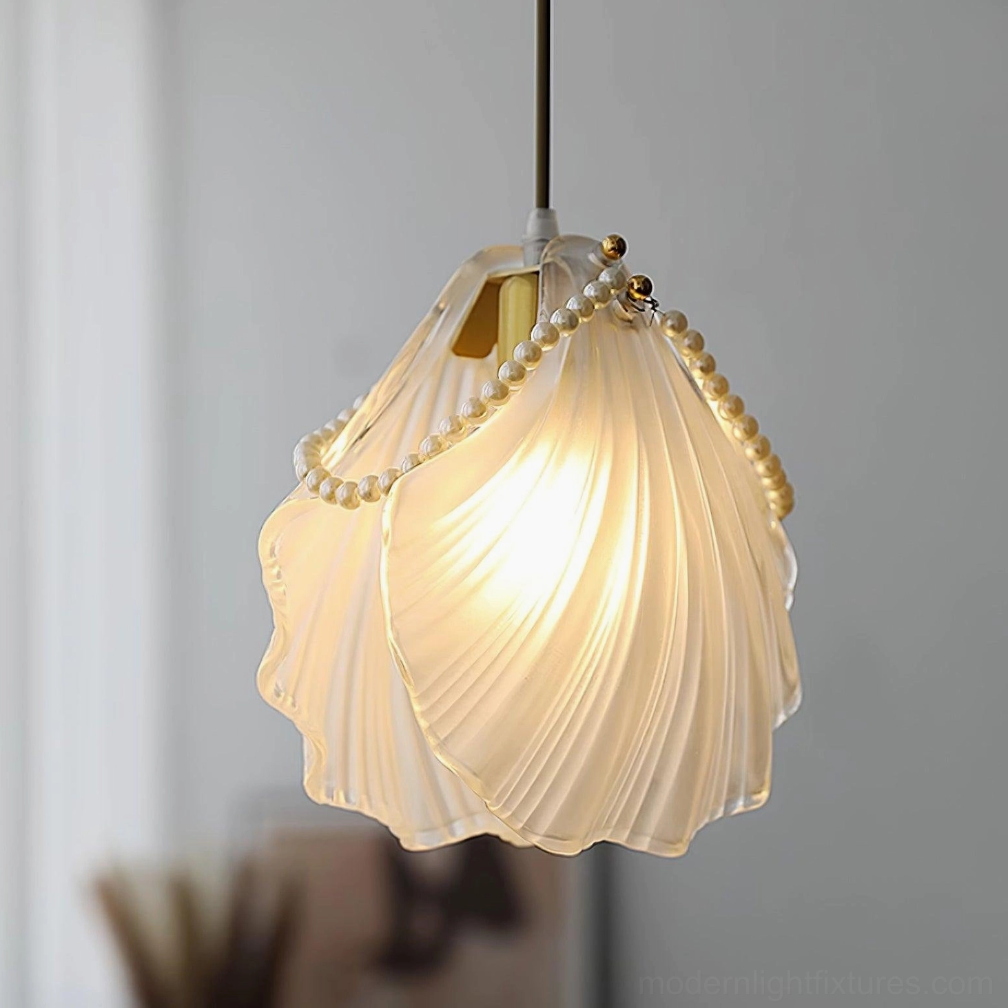 Luxury pearl shell pendant light with gold hardware and frosted glass for upscale interiors