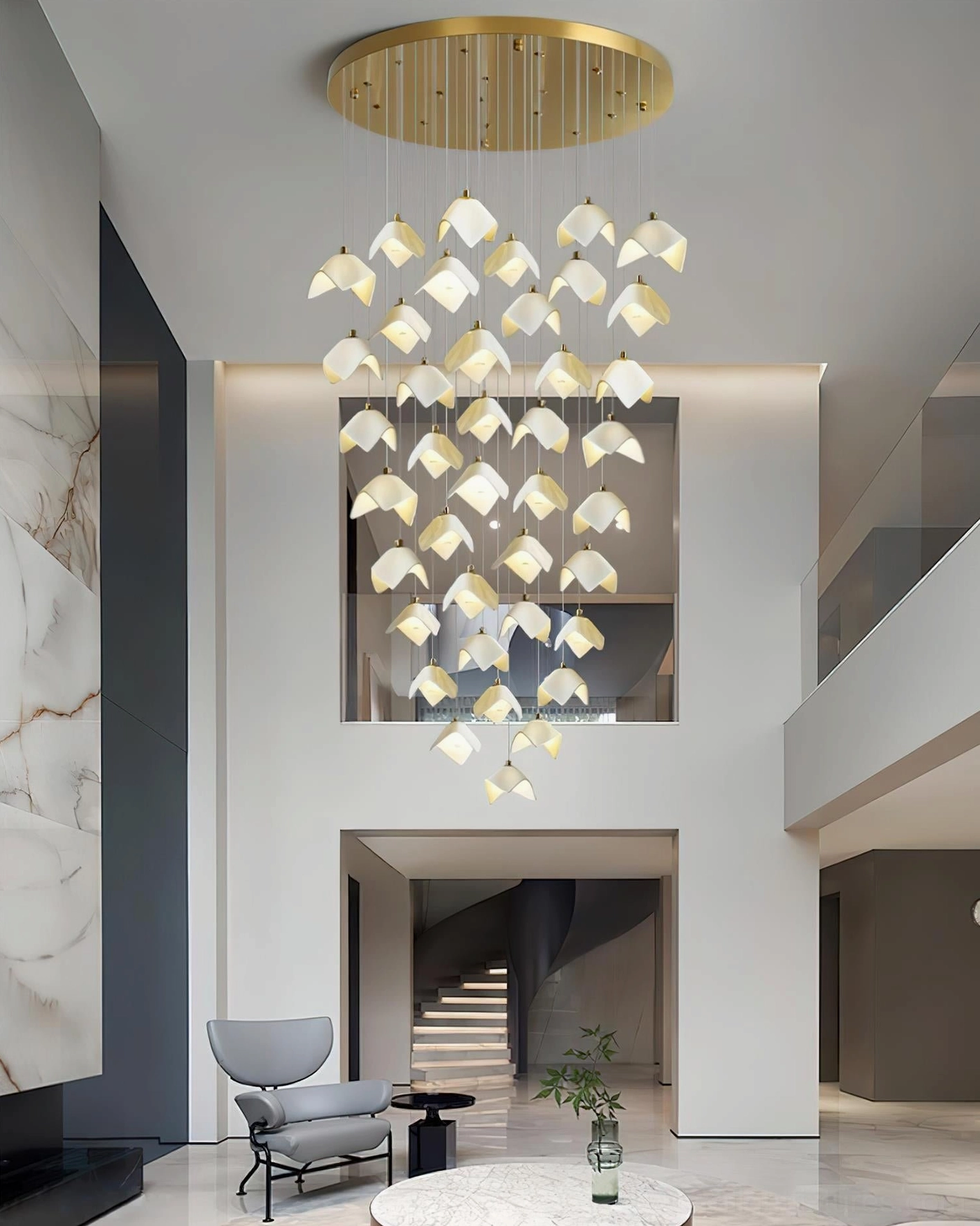 Cascading Bloom chandelier illuminated in double-height modern living room with golden metal base and ceramic shades