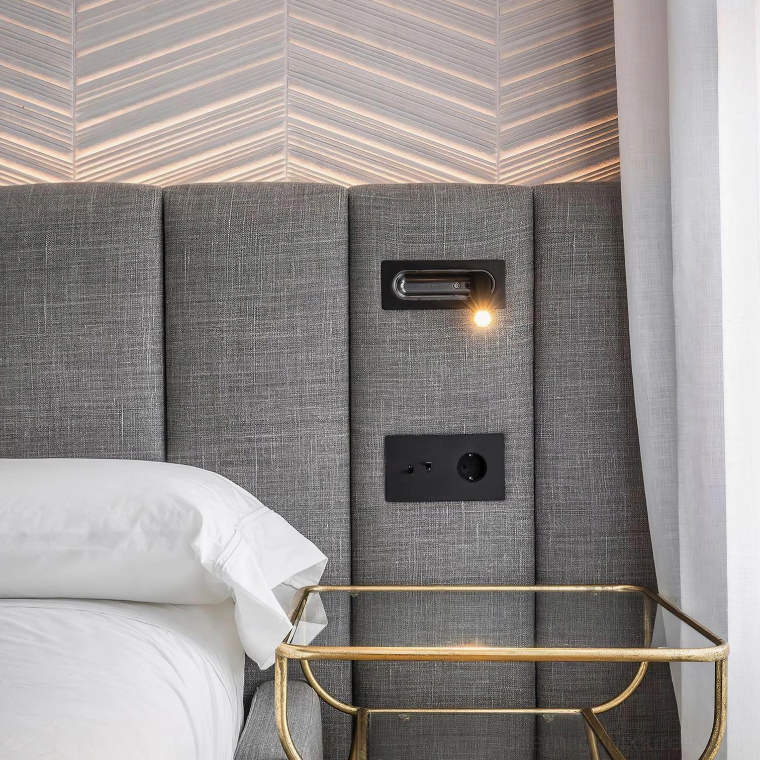 Luxury bedroom design featuring premium recessed wall lamp with refined metal finish and precision light control