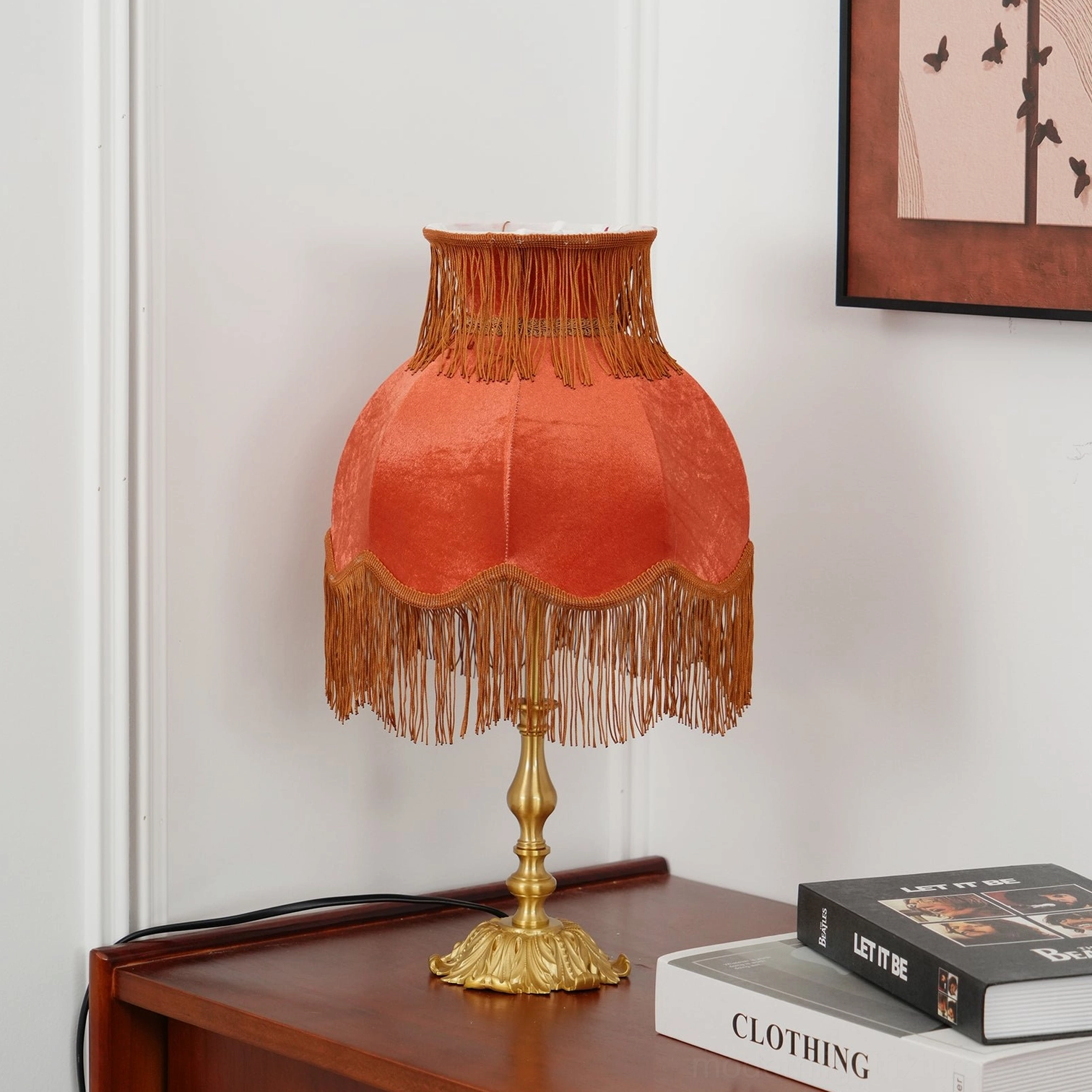 Luxury tassel table lamp with decorative fringe and ornate brass architectural elements