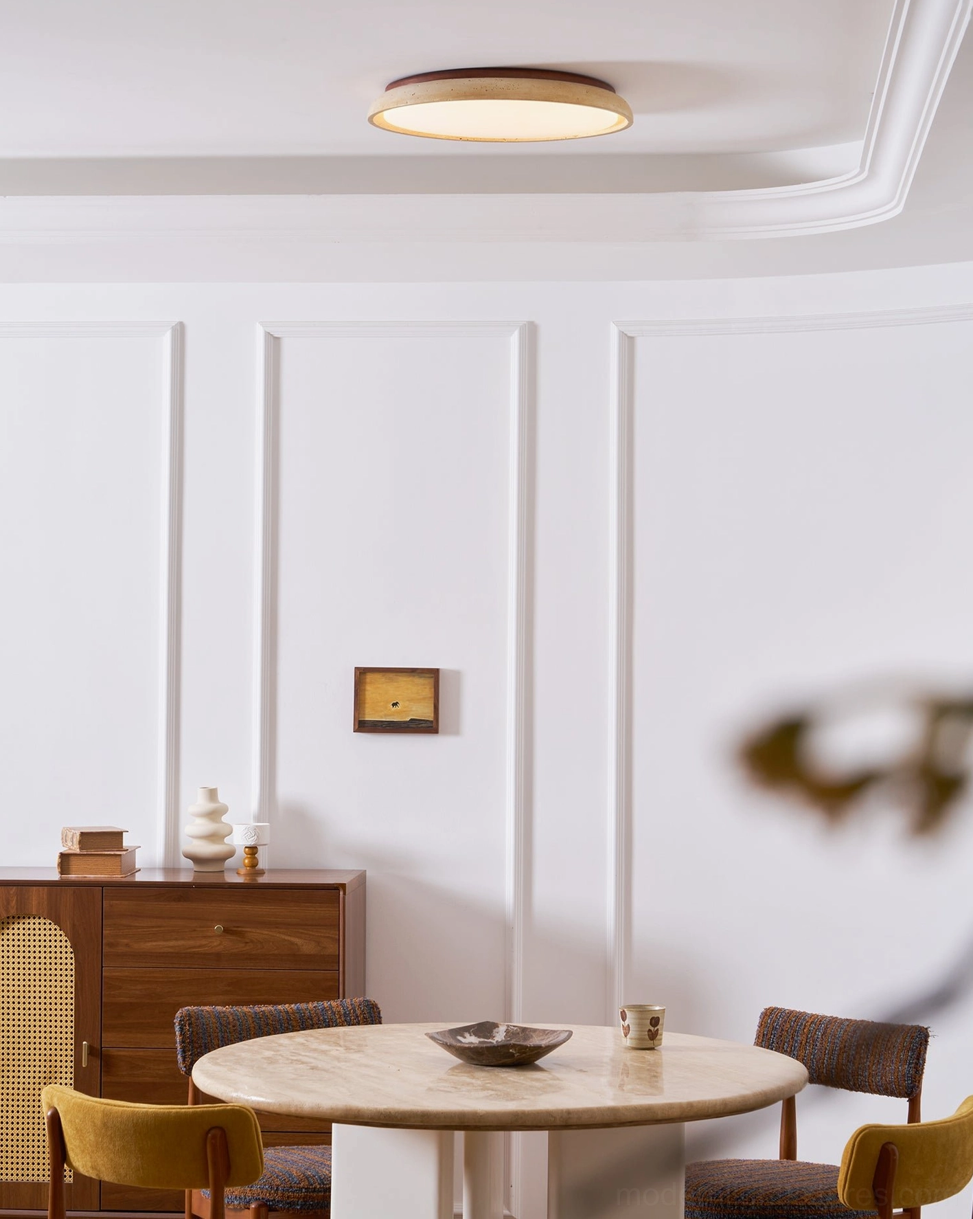 Piedra natural travertine ceiling light in upscale interior with walnut wood and stone materials