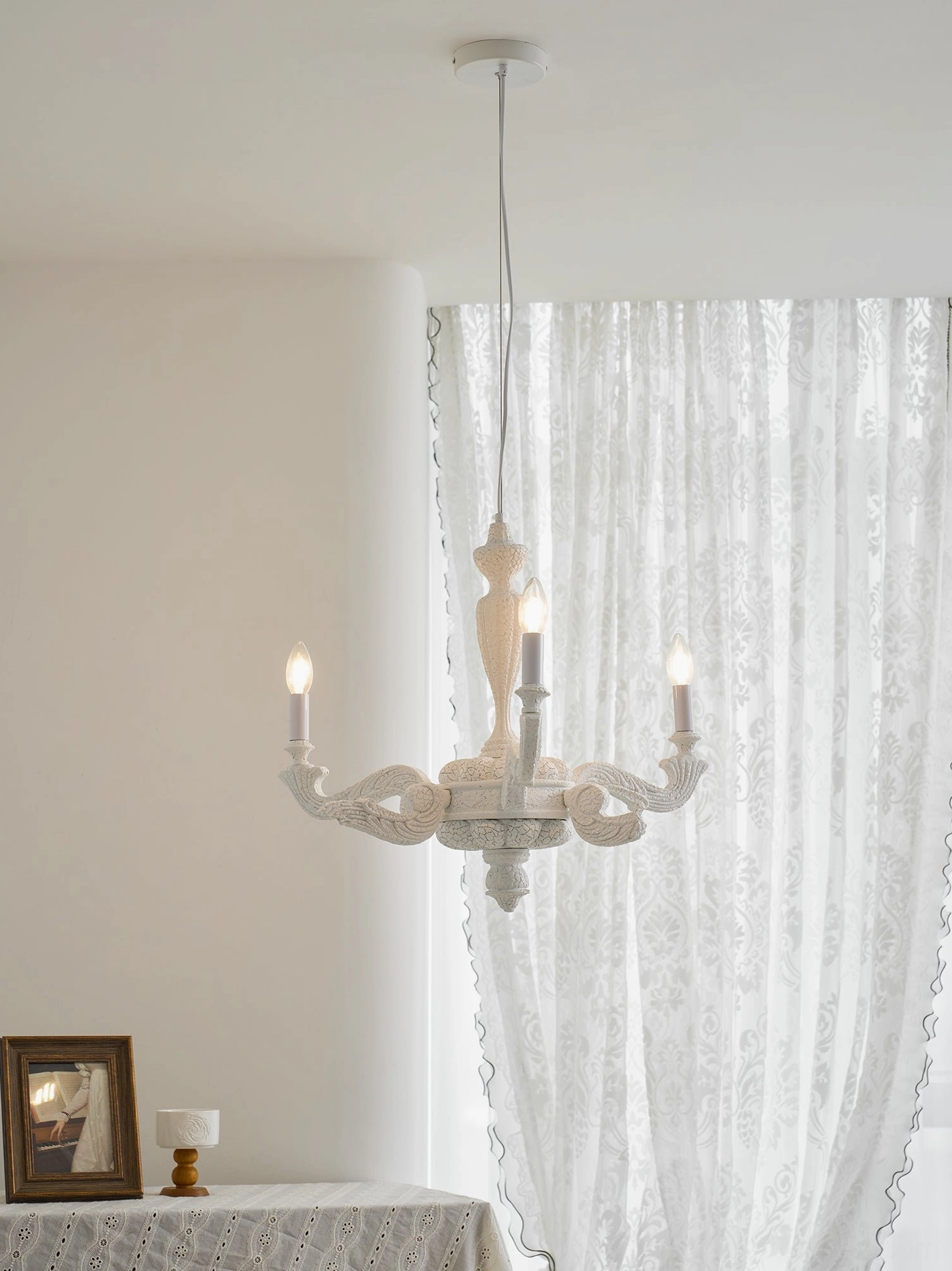 Lvoria modern chandelier installation showing adjustable hanging height cable and hardwired setup