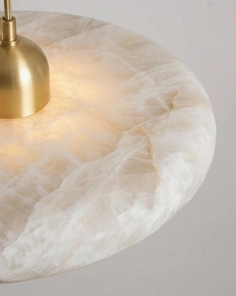 Lydia alabaster pendant lamp installation and scale demonstration in residential interior space, warm integrated LED glow