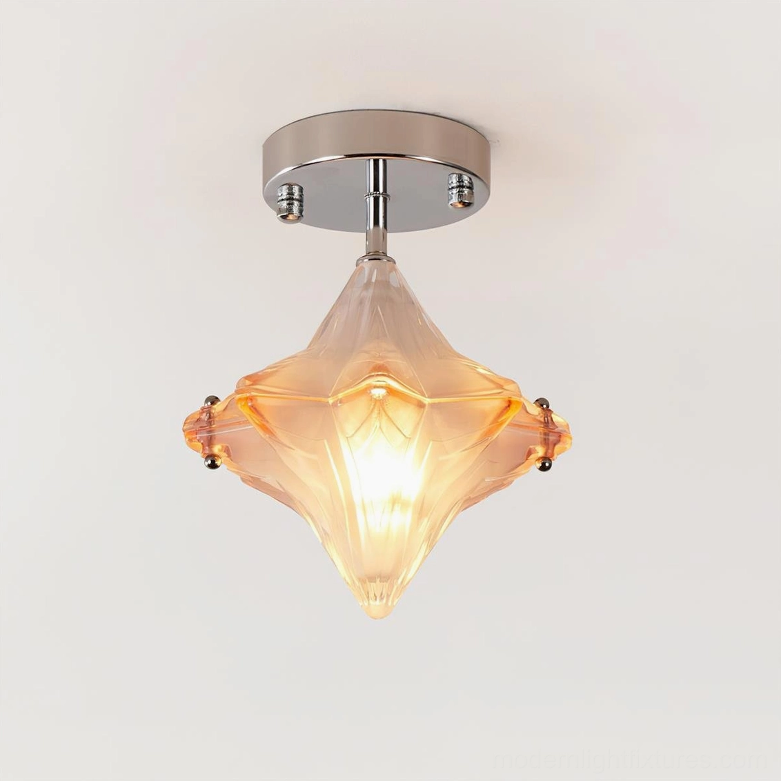 Lyra amber star semi-flush ceiling lamp illuminated, showing warm frosted glass and chrome base from overhead view