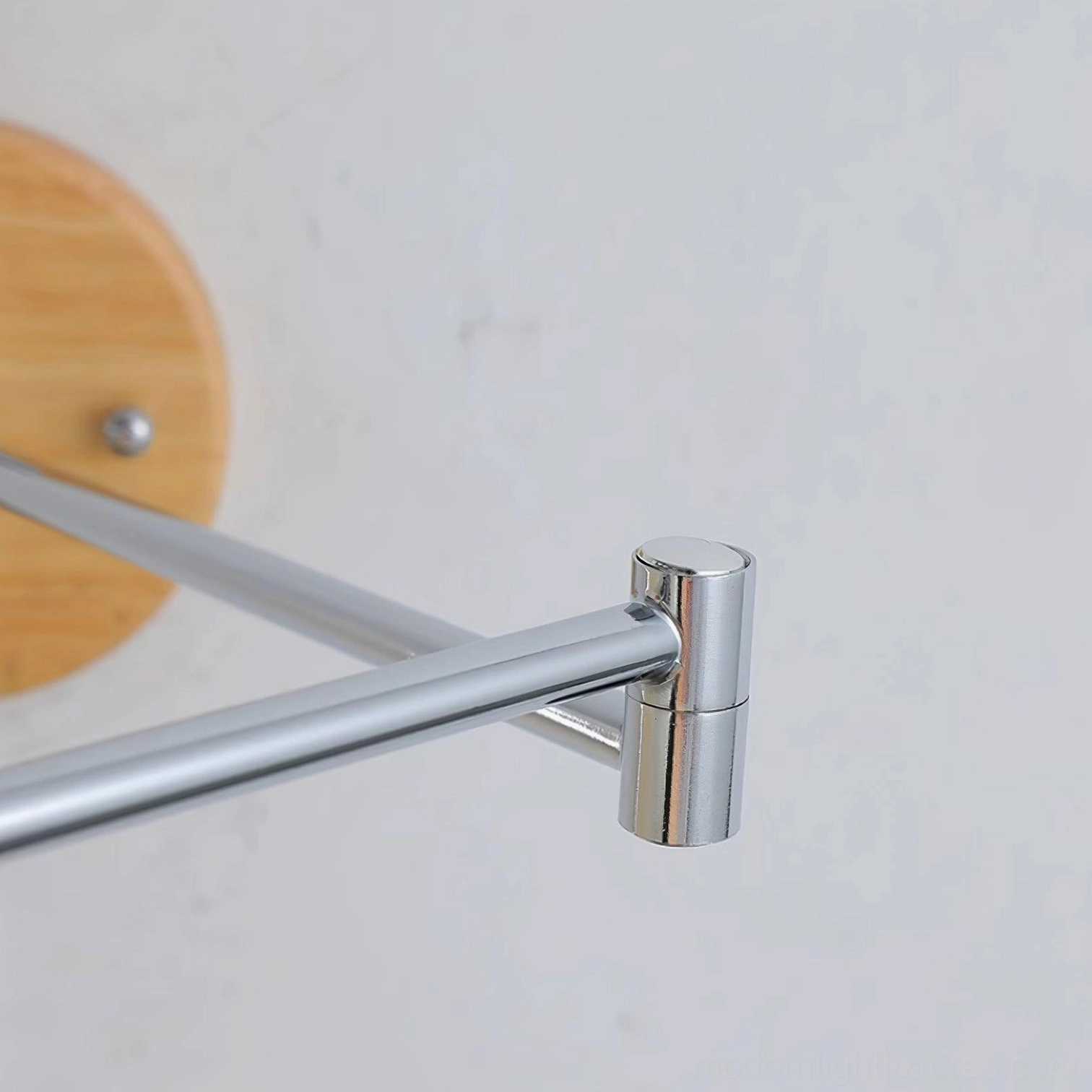 Maddie contemporary wall sconce in various color options demonstrating white, wood tone, and chrome finish versatility