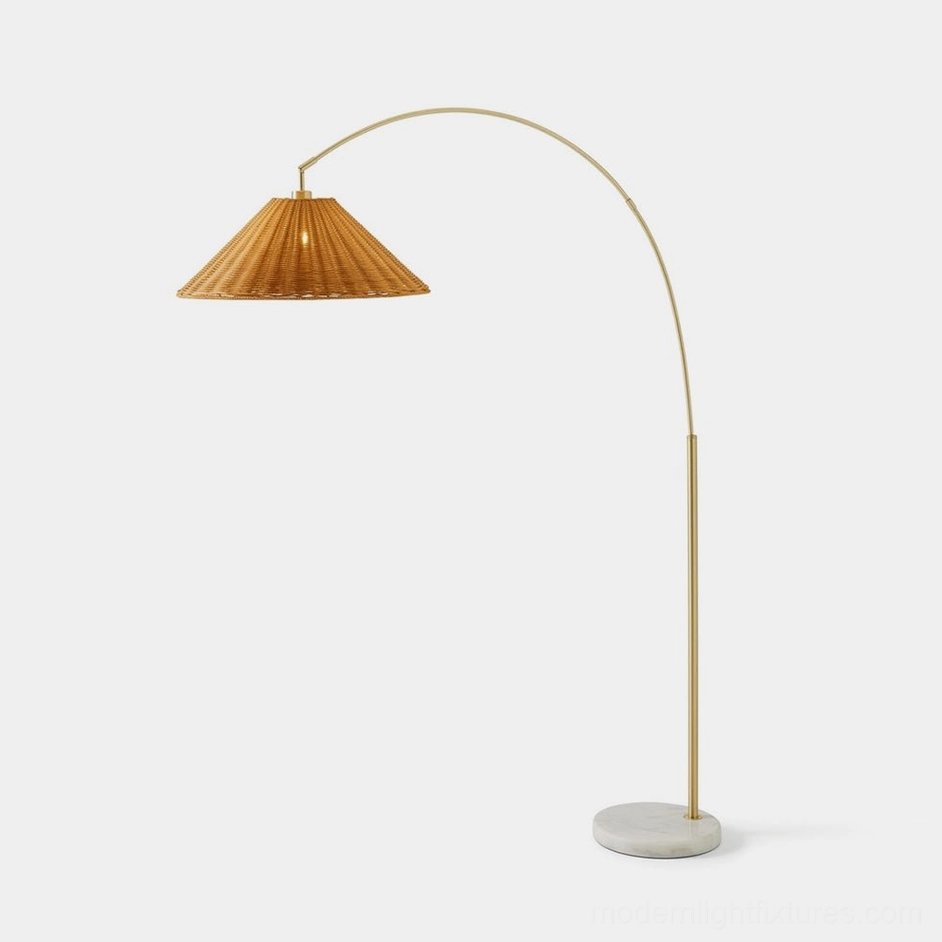 Madera arc floor lamp with gold metal stem and tapered natural rattan shade on white marble base - front view