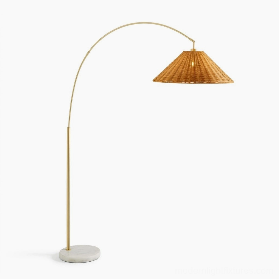 Madera arc floor lamp with warm gold metal stem and natural hand-woven rattan shade - side profile minimalist design