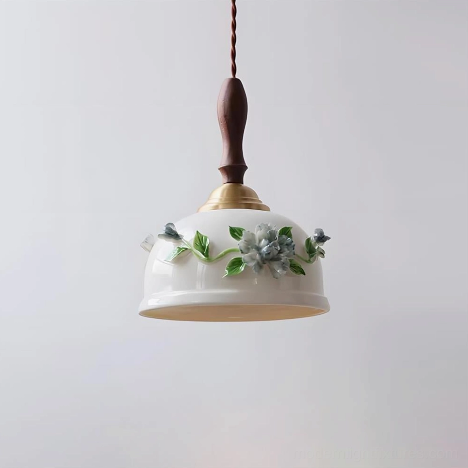 Maelis ceramic pendant lamp white milky finish front overhead view, showing smooth dome shade form and sculptural ceramic quality in studio setting