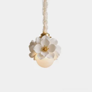 Magnelle floral pendant light with white ceramic petals and frosted glass diffuser, front view on clean white background showing polished gold hardware and romantic flower design
