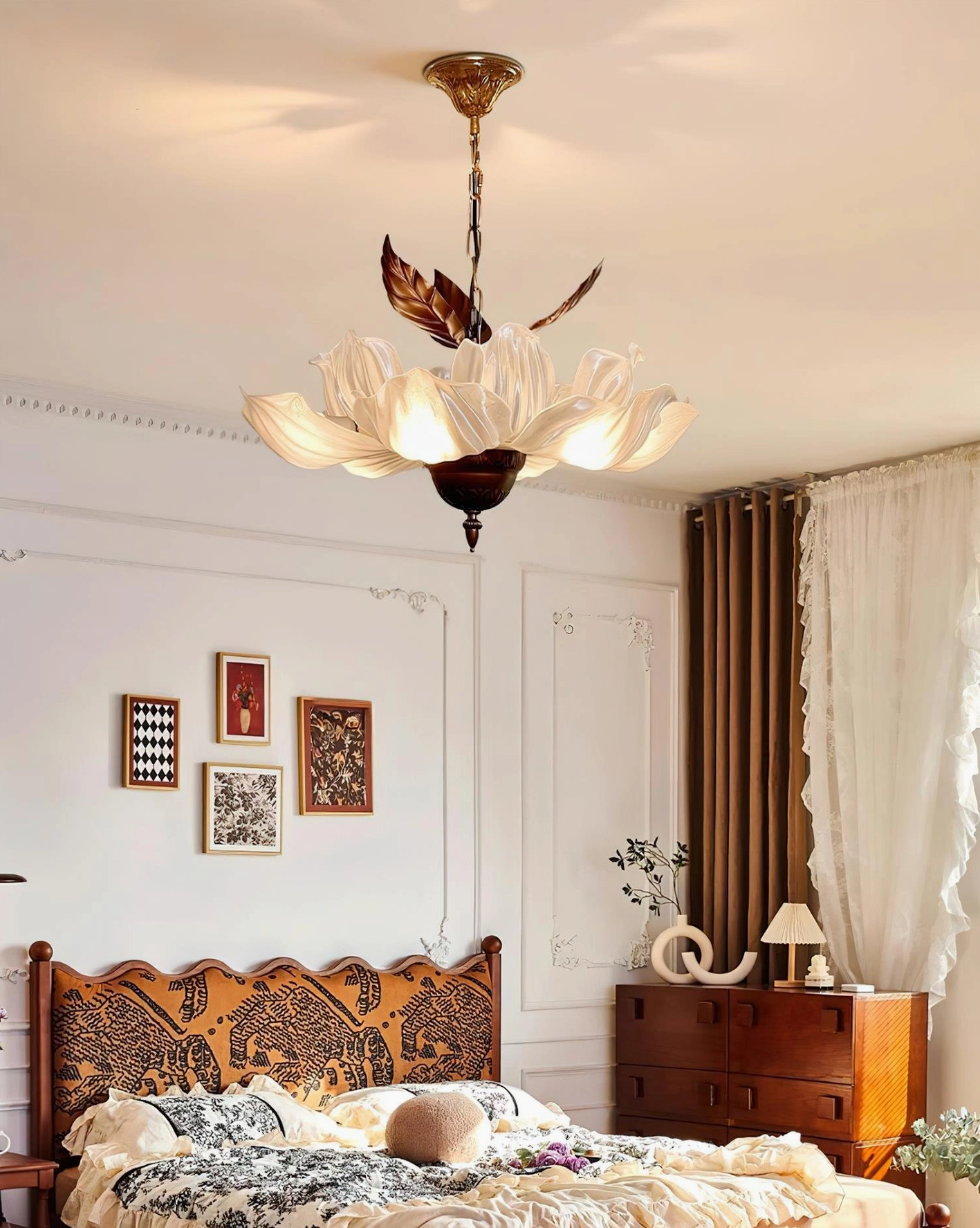 Magnolia Bloom pendant light in warm vintage bedroom with carved wooden headboard ambient lighting