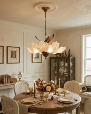 Magnolia Bloom chandelier installed overhead in vintage French dining room with floral centerpiece
