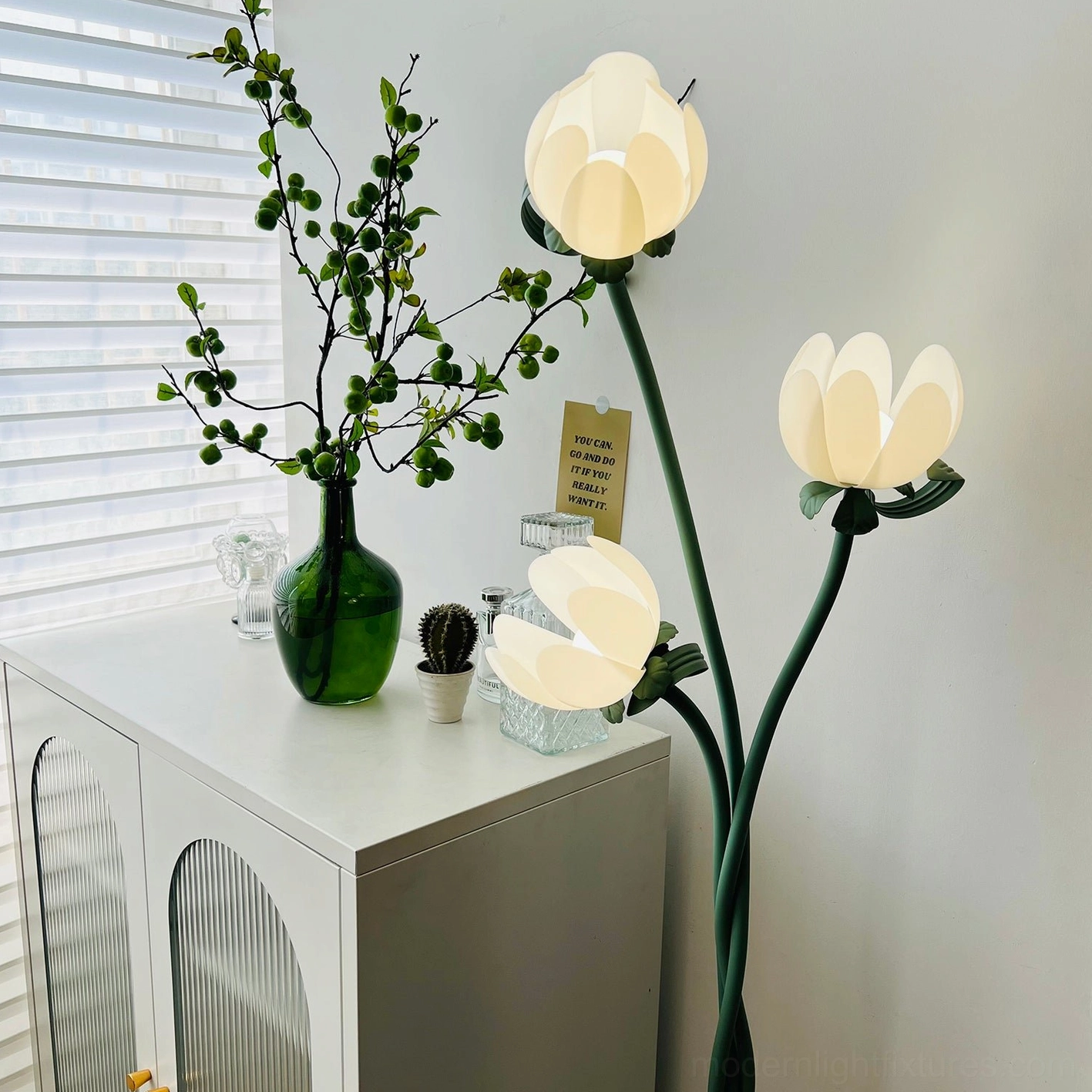 Magnolia floor lamp three-head botanical design with curved green metal stem in fresh pastoral home decor setting