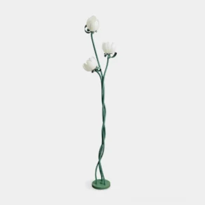 Magnolia bud floor lamp with three white bloom-shaped acrylic shades and twisted green metal stem on white studio background