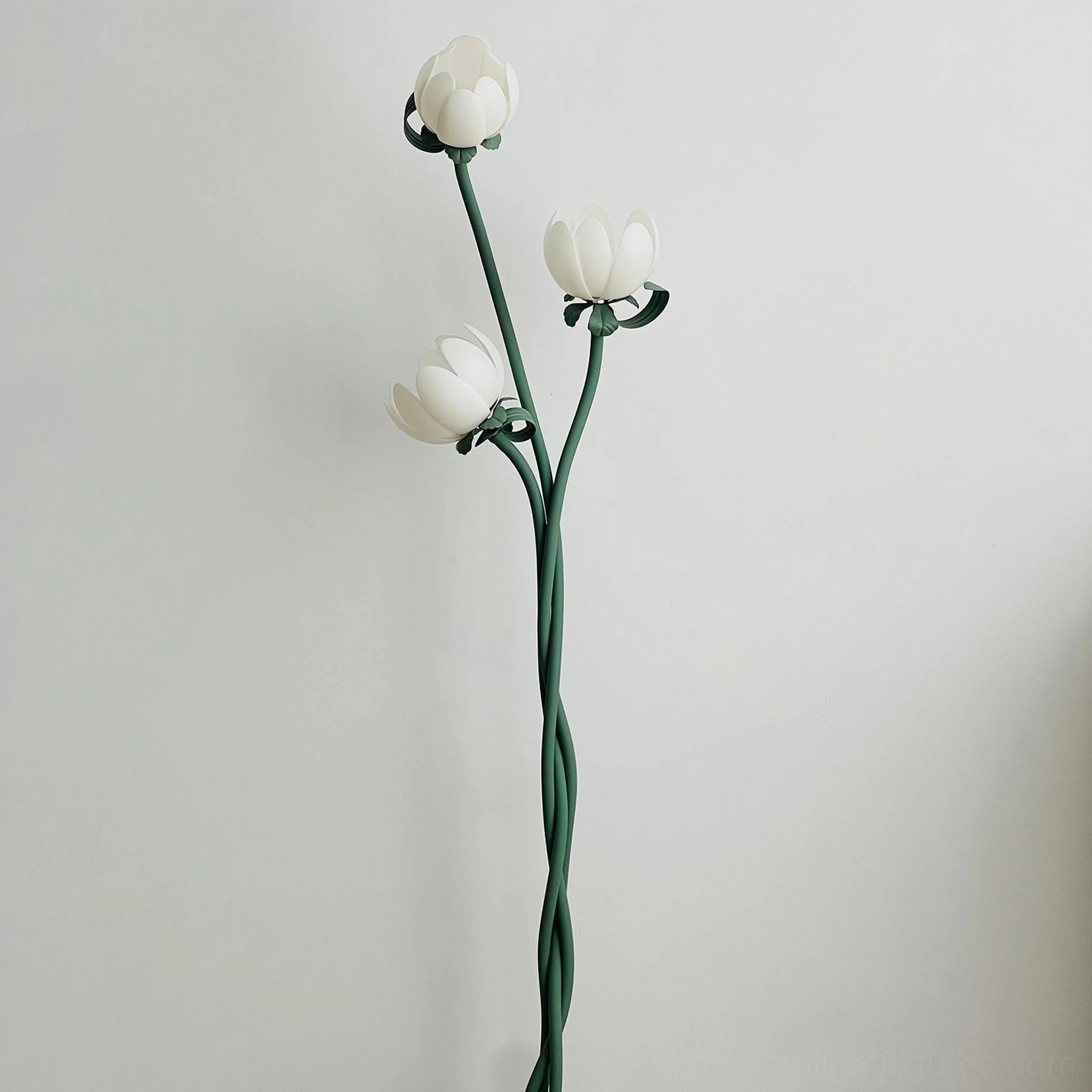 Magnolia three-bloom floor lamp in bedroom setting with soft warm neutral white 4000K light creating serene atmosphere