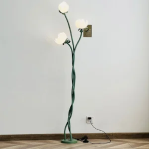 Magnolia floor lamp with lit white acrylic bloom shades casting warm ambient glow in modern living room with wooden flooring