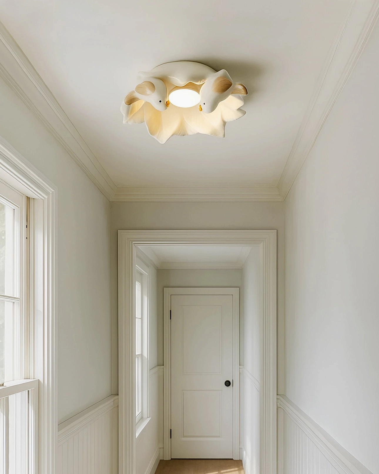 Modern Magnolia Nest bird ceiling lamp mounted in minimalist hallway with neutral wall tones and soft lighting
