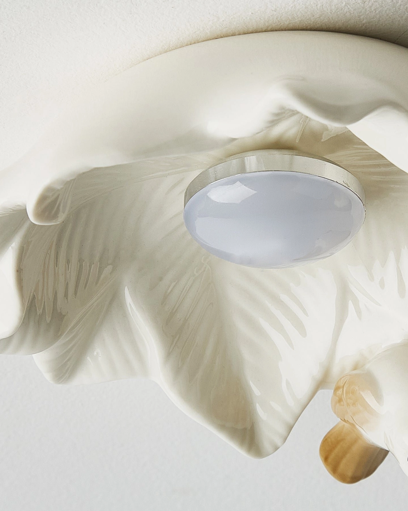 Magnolia Nest ceramic bird ceiling lamp showing delicate botanical artistry and warm ambient light diffusion for residential spaces