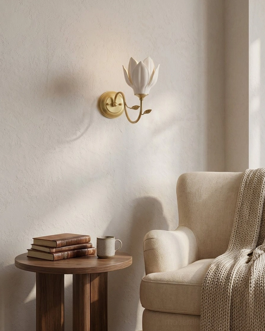 Magnolia wall sconce accent lighting in living room reading nook with armchair and wooden side table