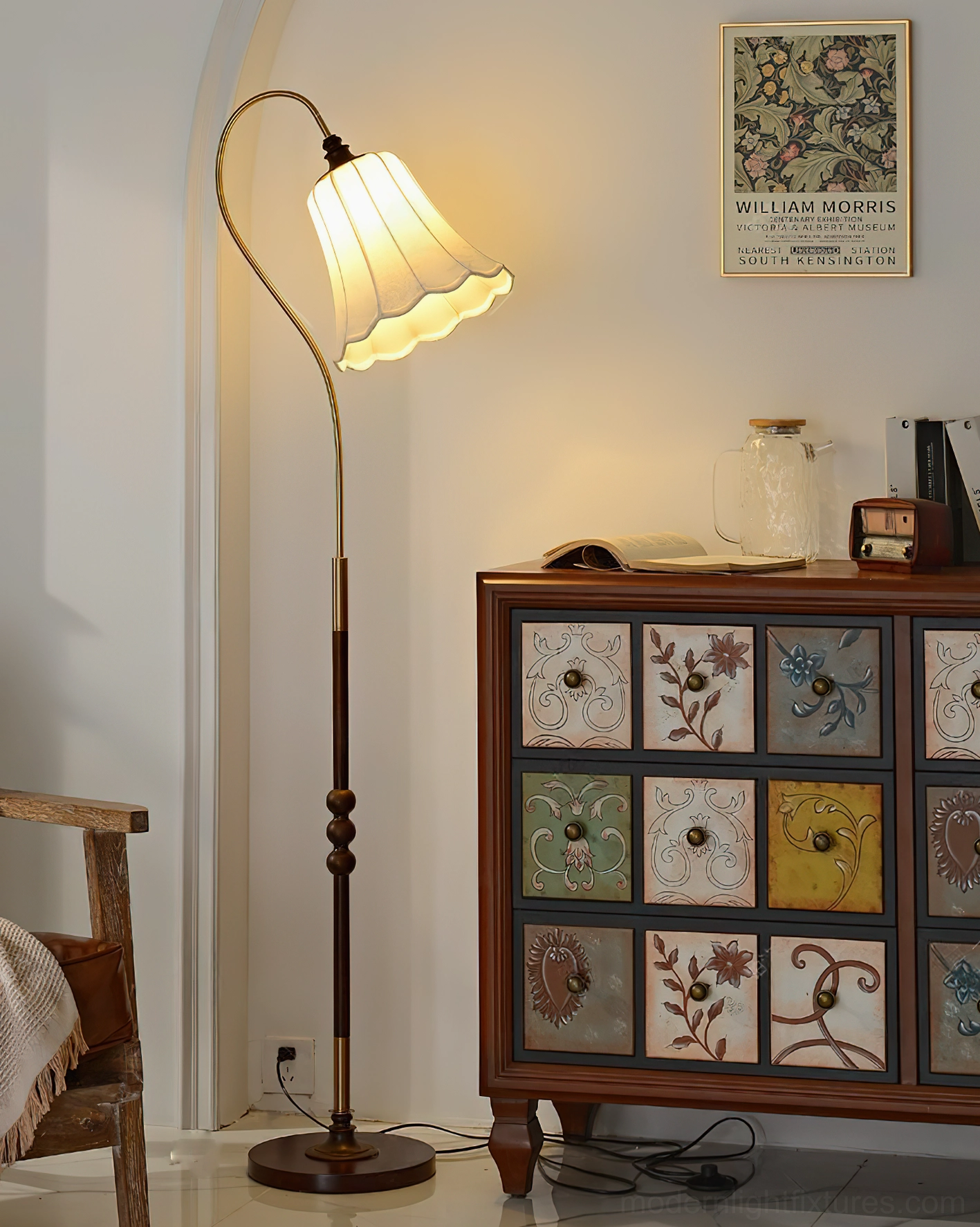 Magnolya arc floor lamp side view vintage living room, curved brass pole with ruffled white fabric shade warm ambient glow