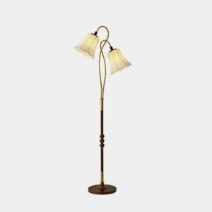 Magnolya vintage dual-head floor lamp front view studio white background, brass metal finish with patterned fabric shades and wooden pole