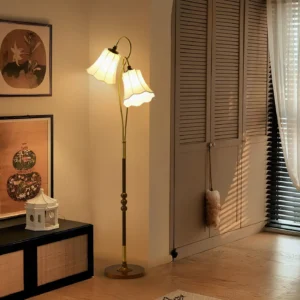 Magnolya retro floor lamp three-quarter view entryway, warm glowing light on decorative beaded metal pole with fabric shades