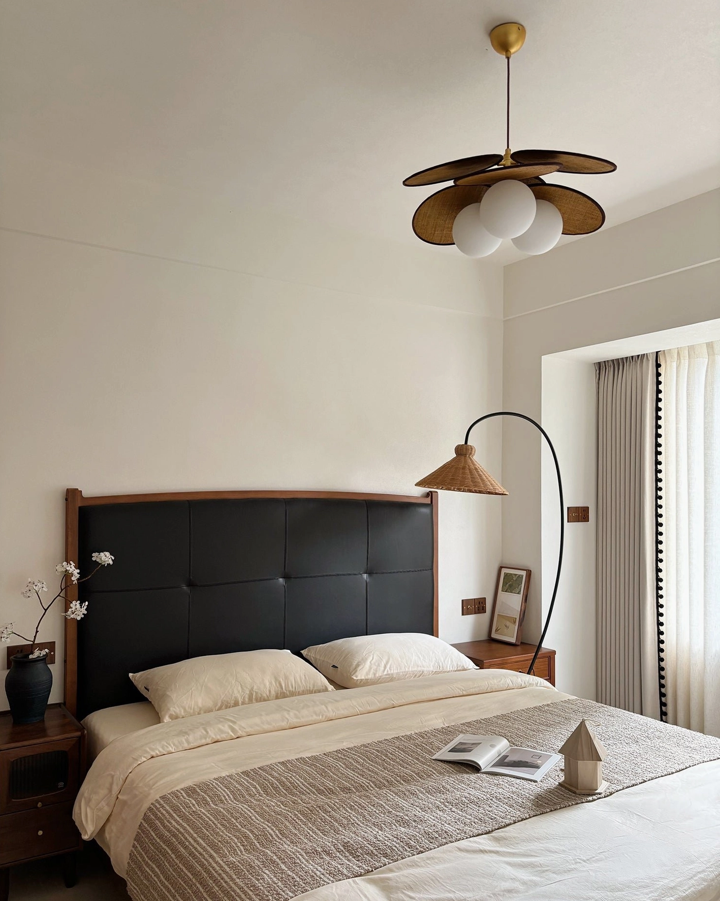 Mahalo wooden pendant light installed in modern master bedroom, warm residential setting matching furniture tones