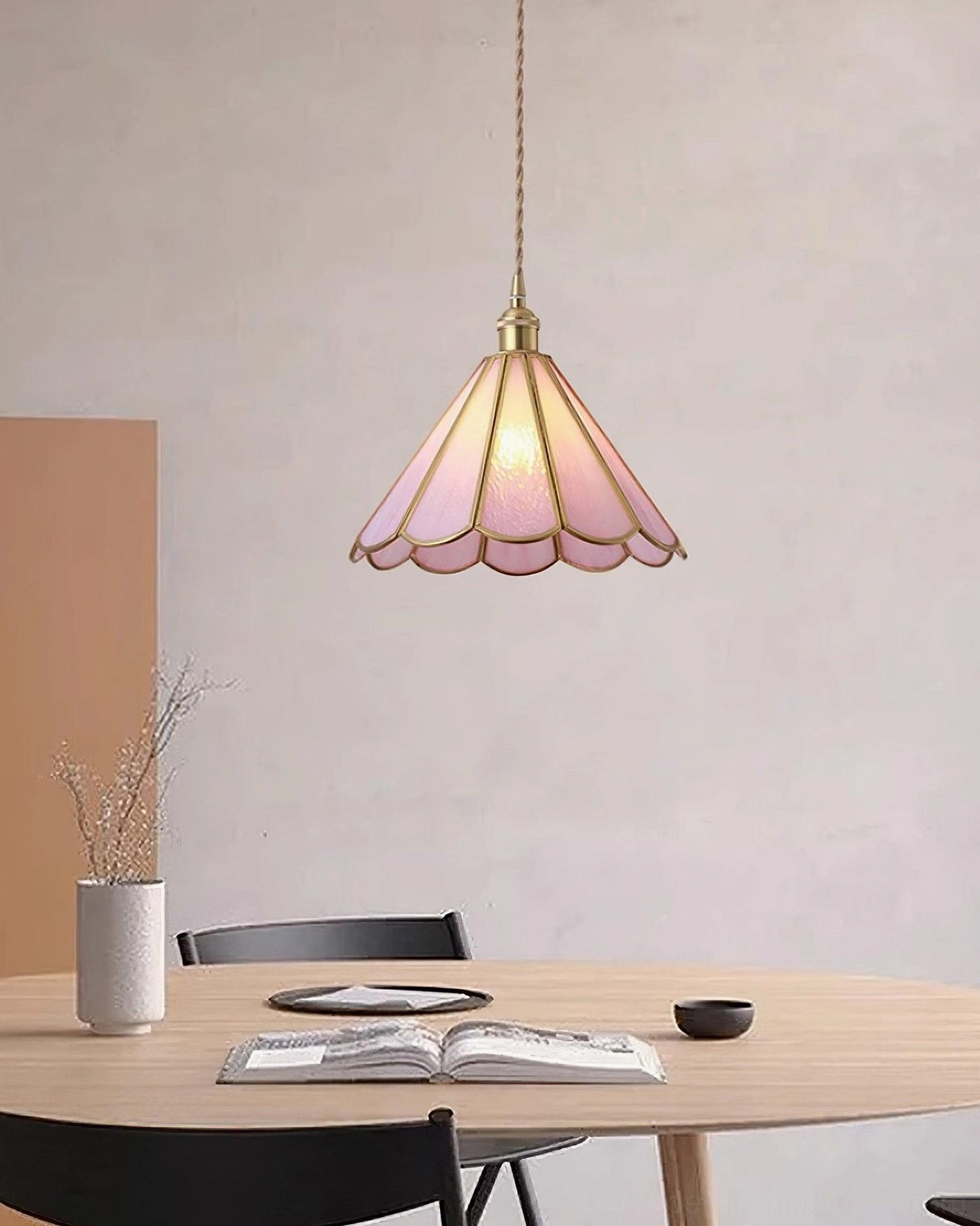 Maki glass pendant lights creating layered ambient and task lighting in dining area