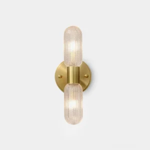Mallory brass wall sconce with dual ribbed glass shades front view studio lighting