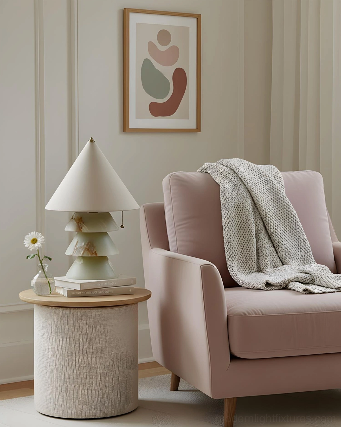 Sculptural table lamp in cozy reading nook with pink accent armchair, ambient lighting design