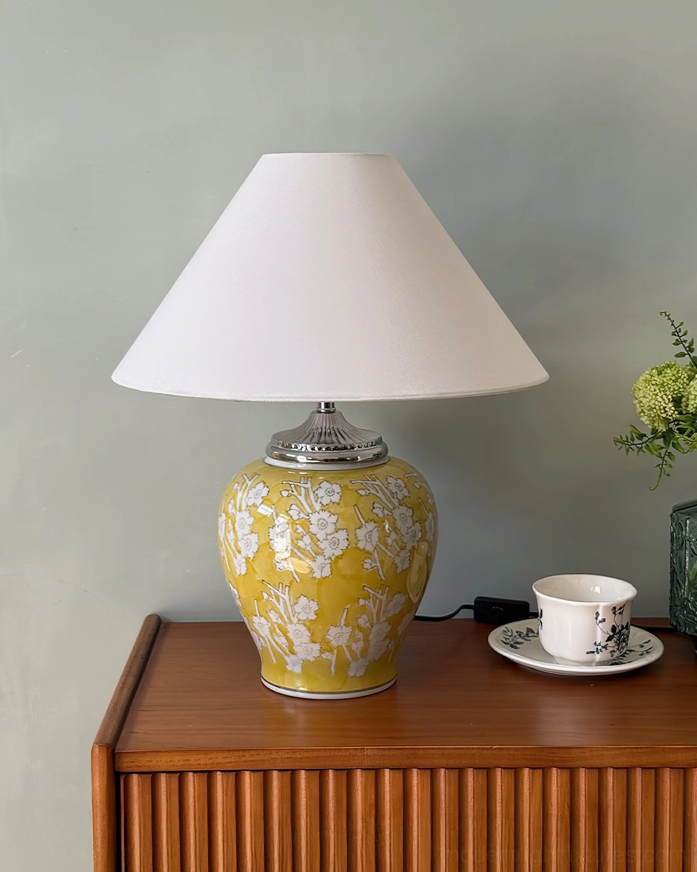 Complete mandarin ceramic table lamp fixture displaying tapered linen shade, silver metal hardware accents, and sculptural ginger jar ceramic base in rich glazed finish