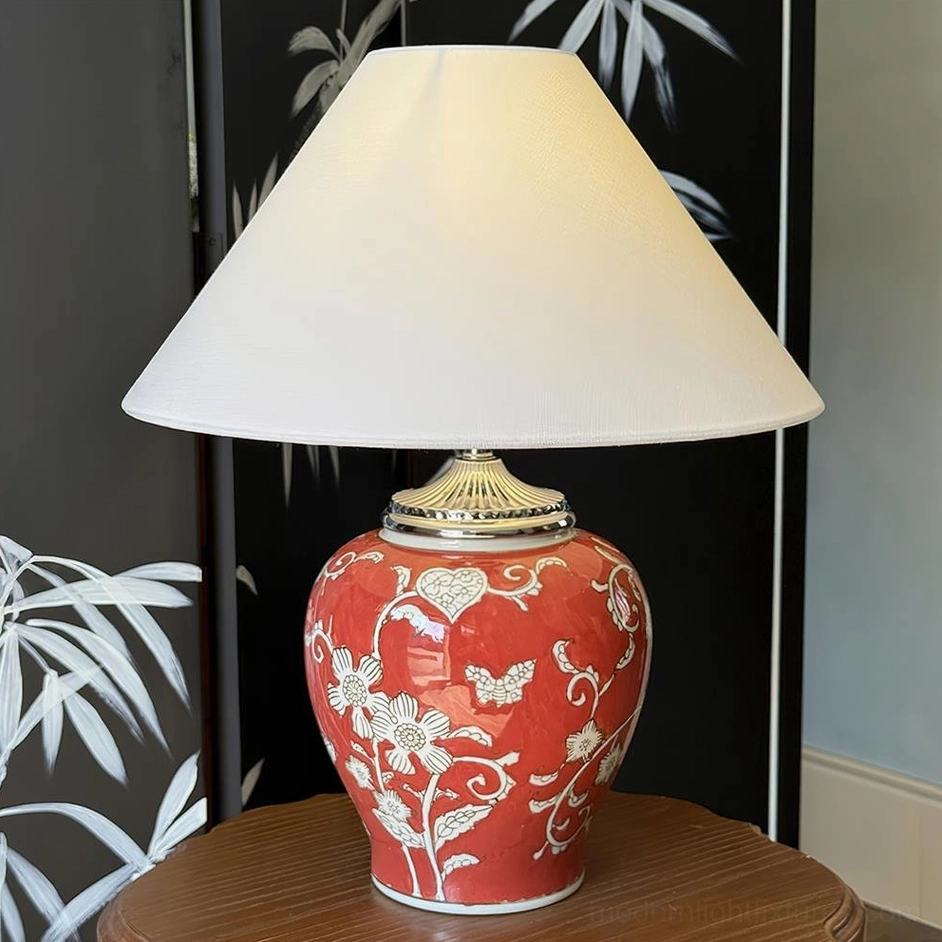 Crimson red hand-glazed ceramic table lamp with white flower patterns and classic fabric shade, statement lighting piece for modern and transitional interior design styles