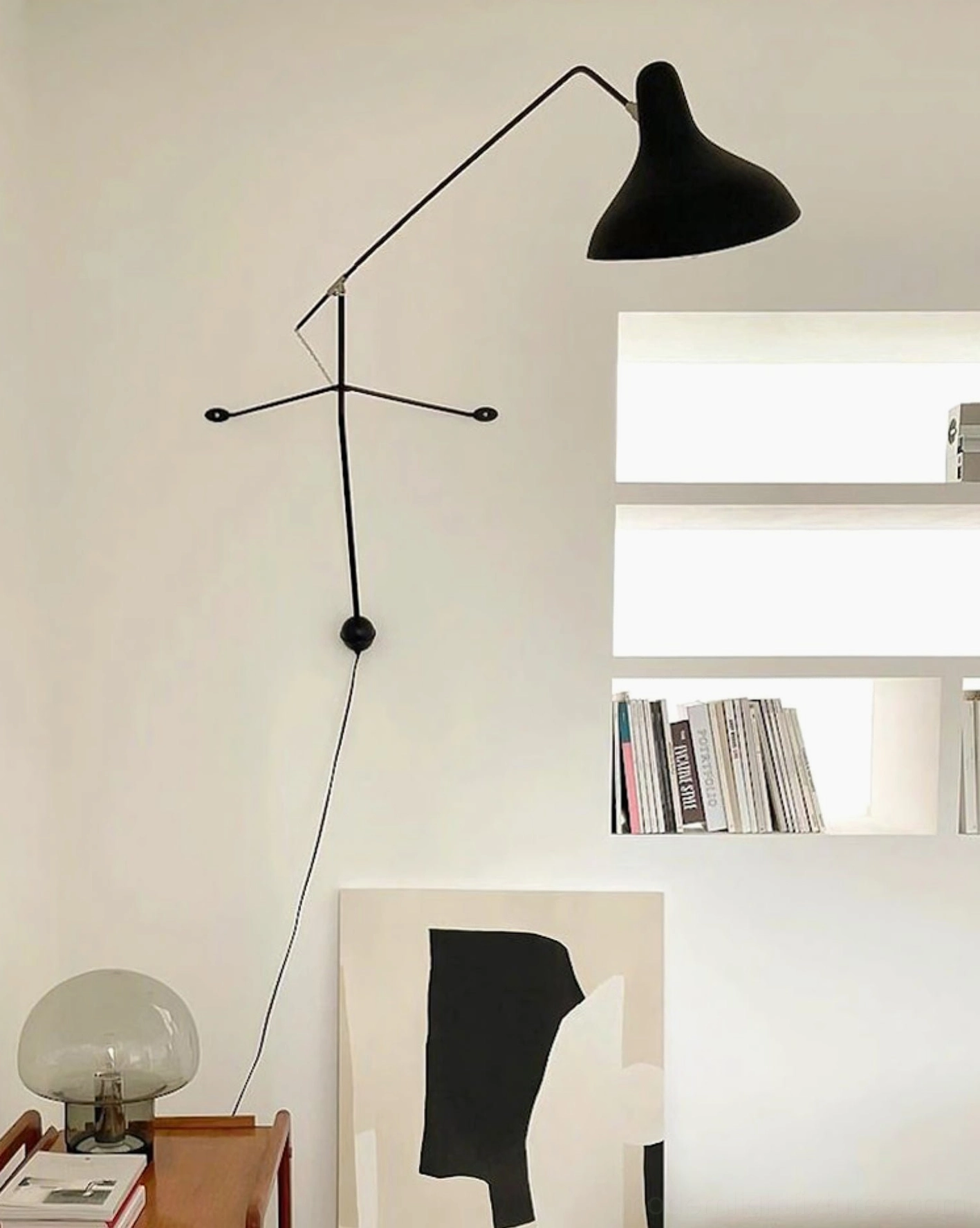 Black articulating wall lamp side view Nordic study interior design