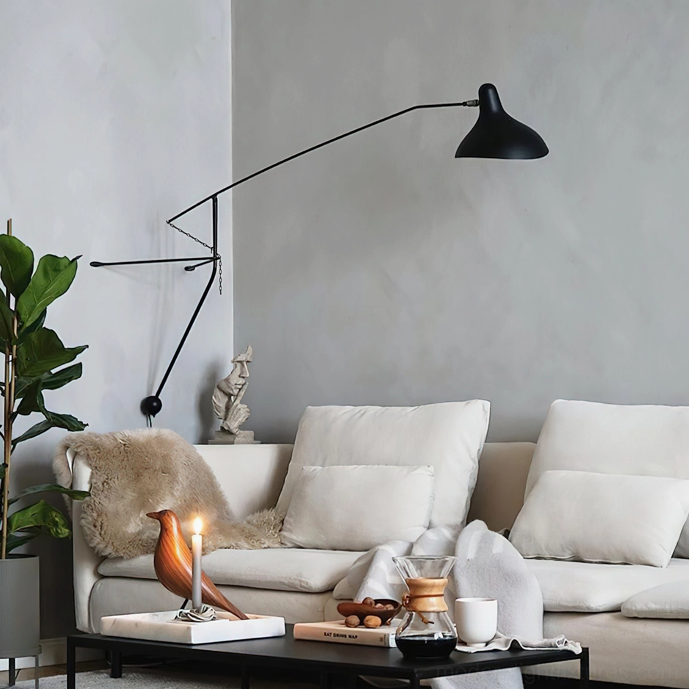 Long-arm black wall sconce in modern living room with mid-century furniture
