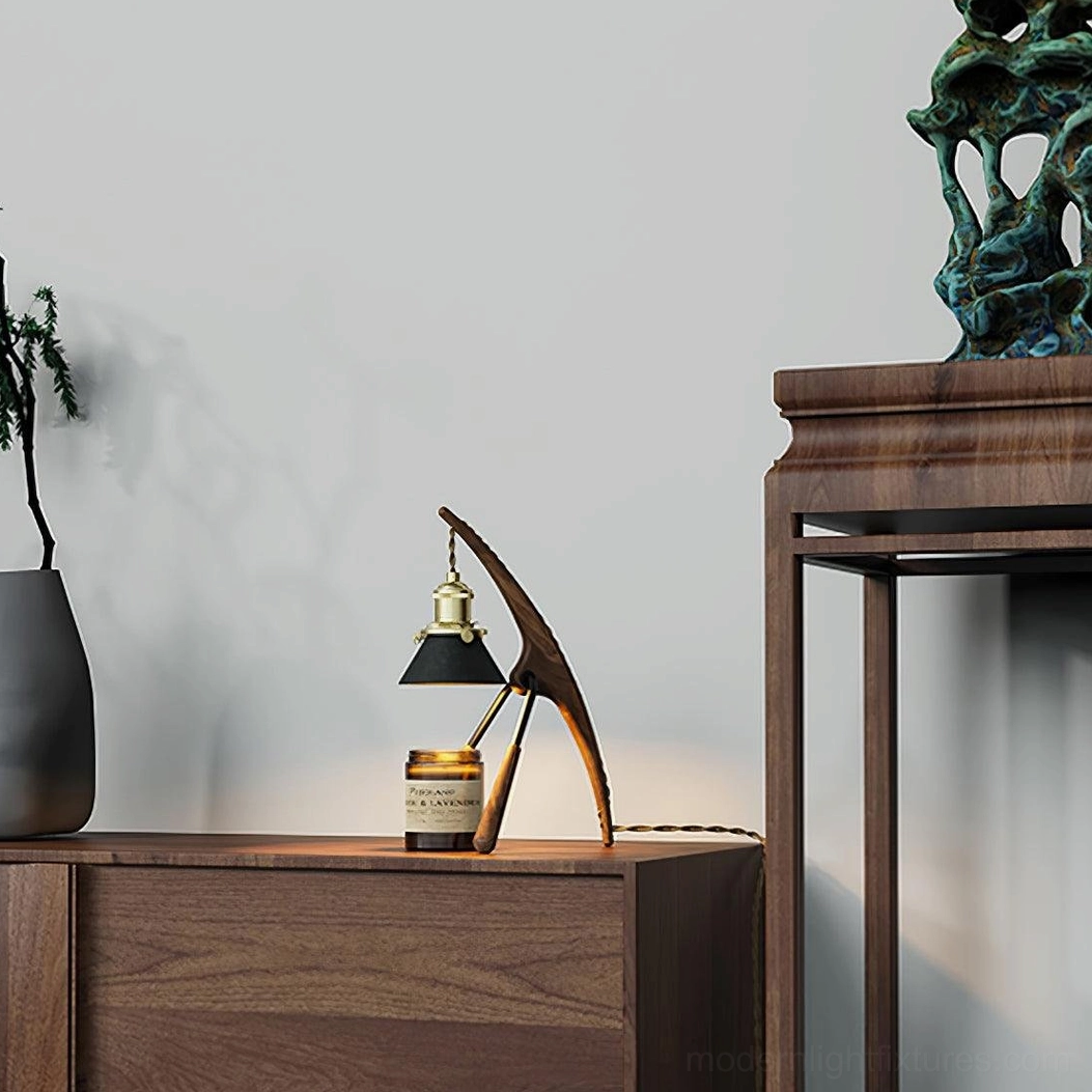 Retro mantis wax warmer lamp styled on bedroom dresser with wooden cabinet and decorative stone sculpture
