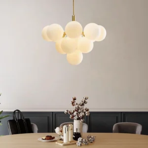 Glass globe cluster chandelier overhead view in formal dining room with elegant table setting
