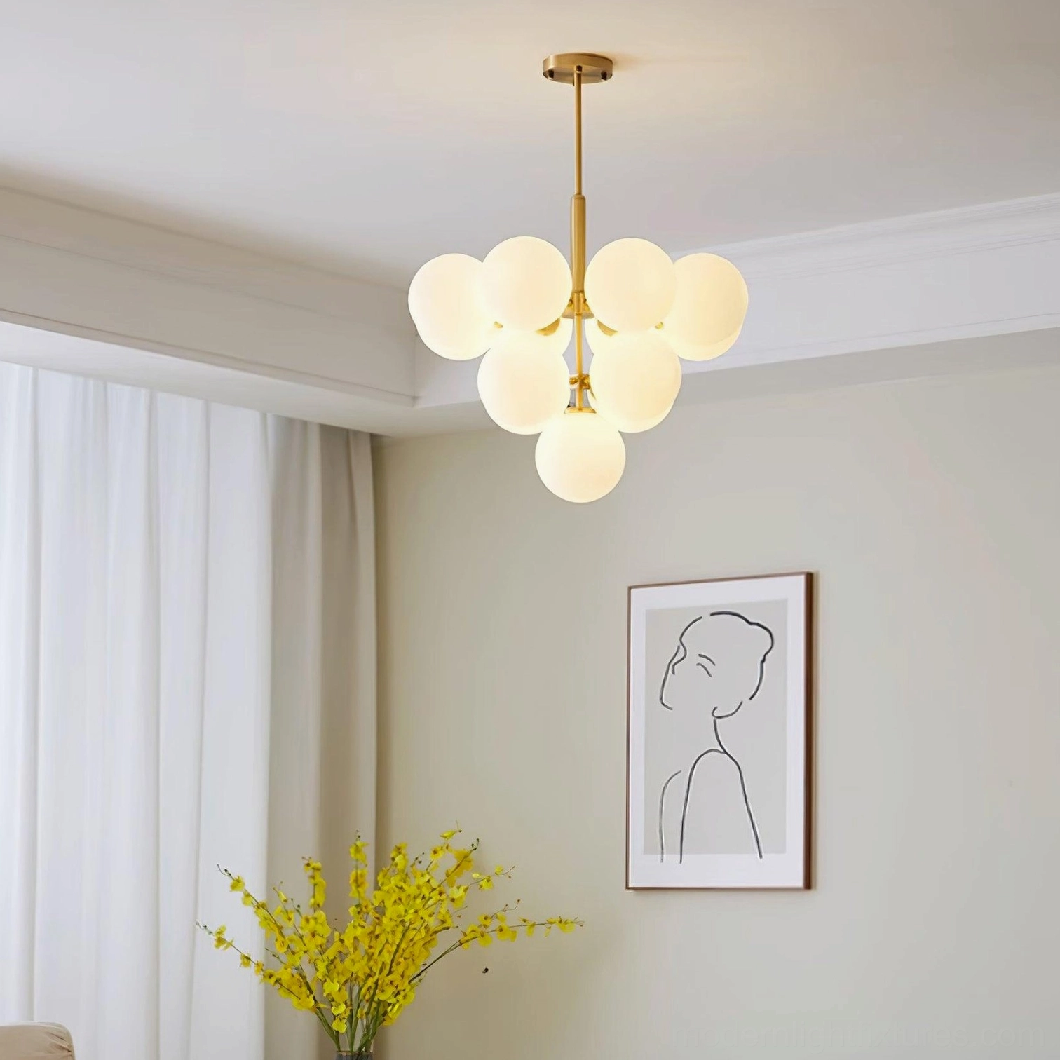 Modern glass bubble pendant chandelier installed in contemporary living room with neutral decor